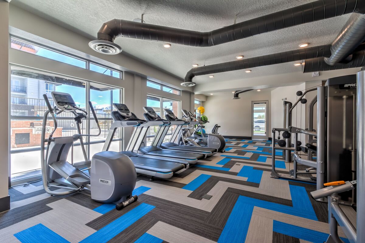 indoor gym with blue, grey and black carpet