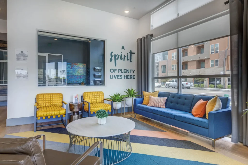 clubhouse view with sign on back wall that says " A spirit of plenty lives here"