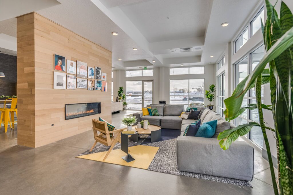 Clubhouse lounge with sofas around a fire place